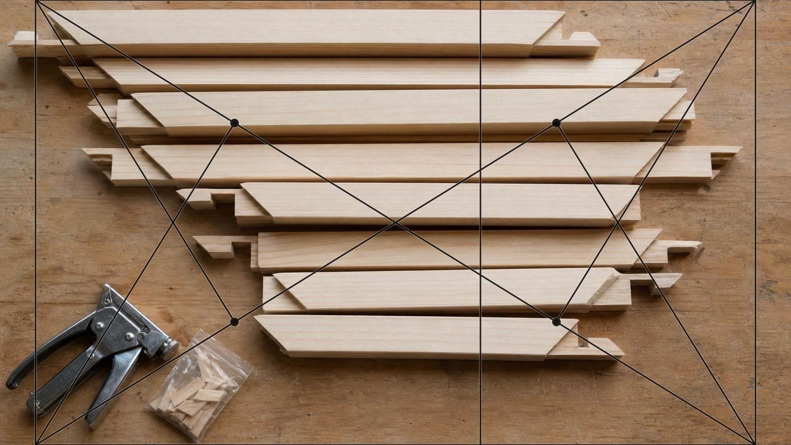Canvas size overlay on stacked timber stretcher bars of several lengths with keyed corners
