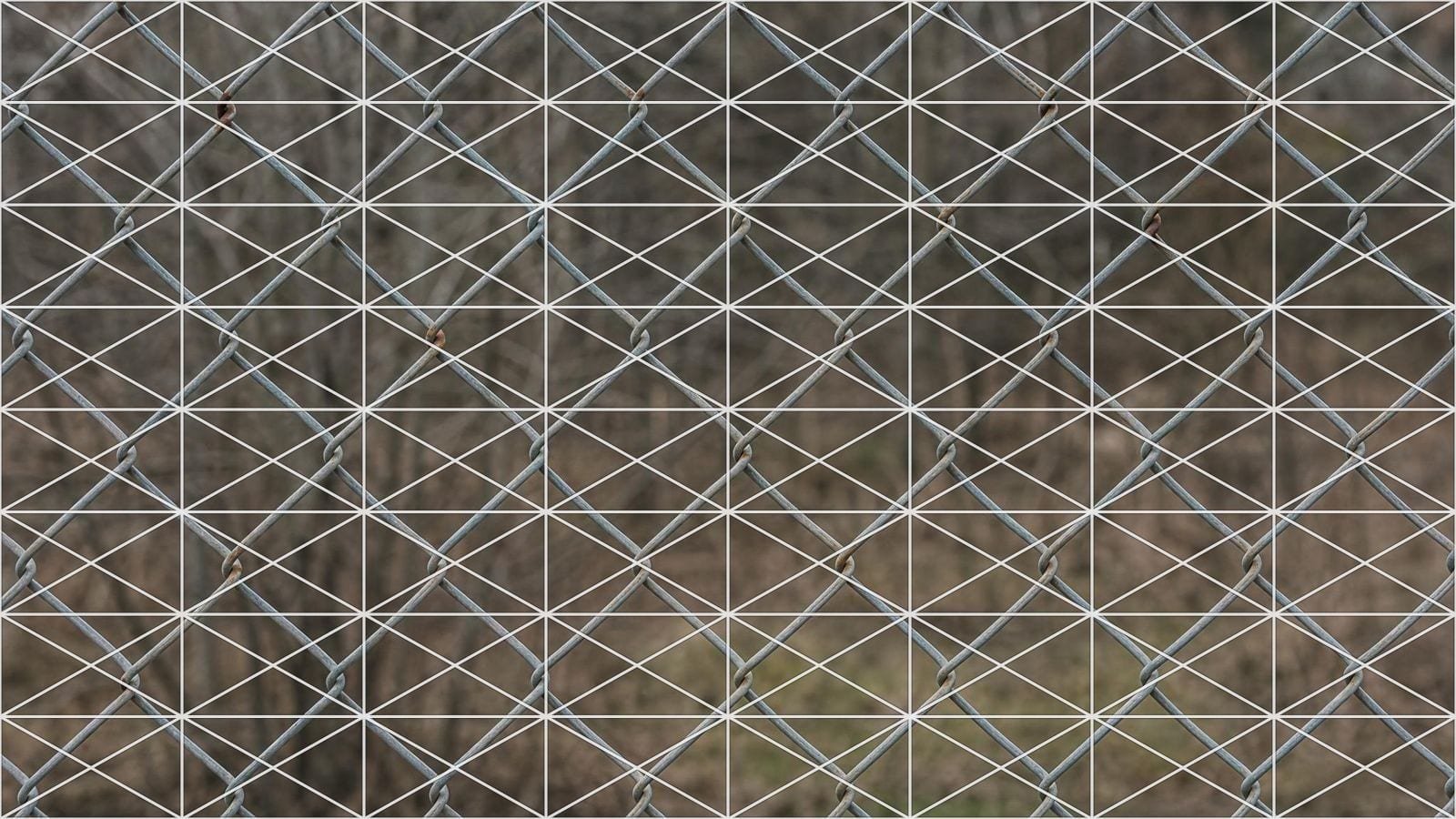 Cross diagonal cell grid overlay on galvanised chain-link mesh with both diagonals crossing