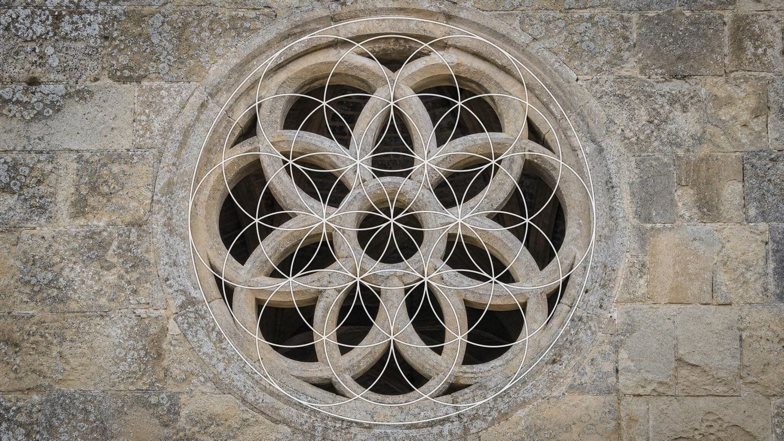 Flower of Life overlay on a carved limestone rosette window with overlapping petals