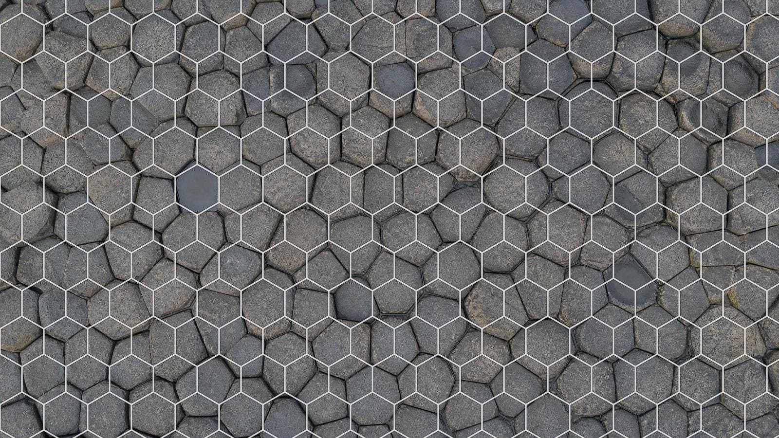 Hexagonal grid overlay on a basalt pavement of natural six-sided columns