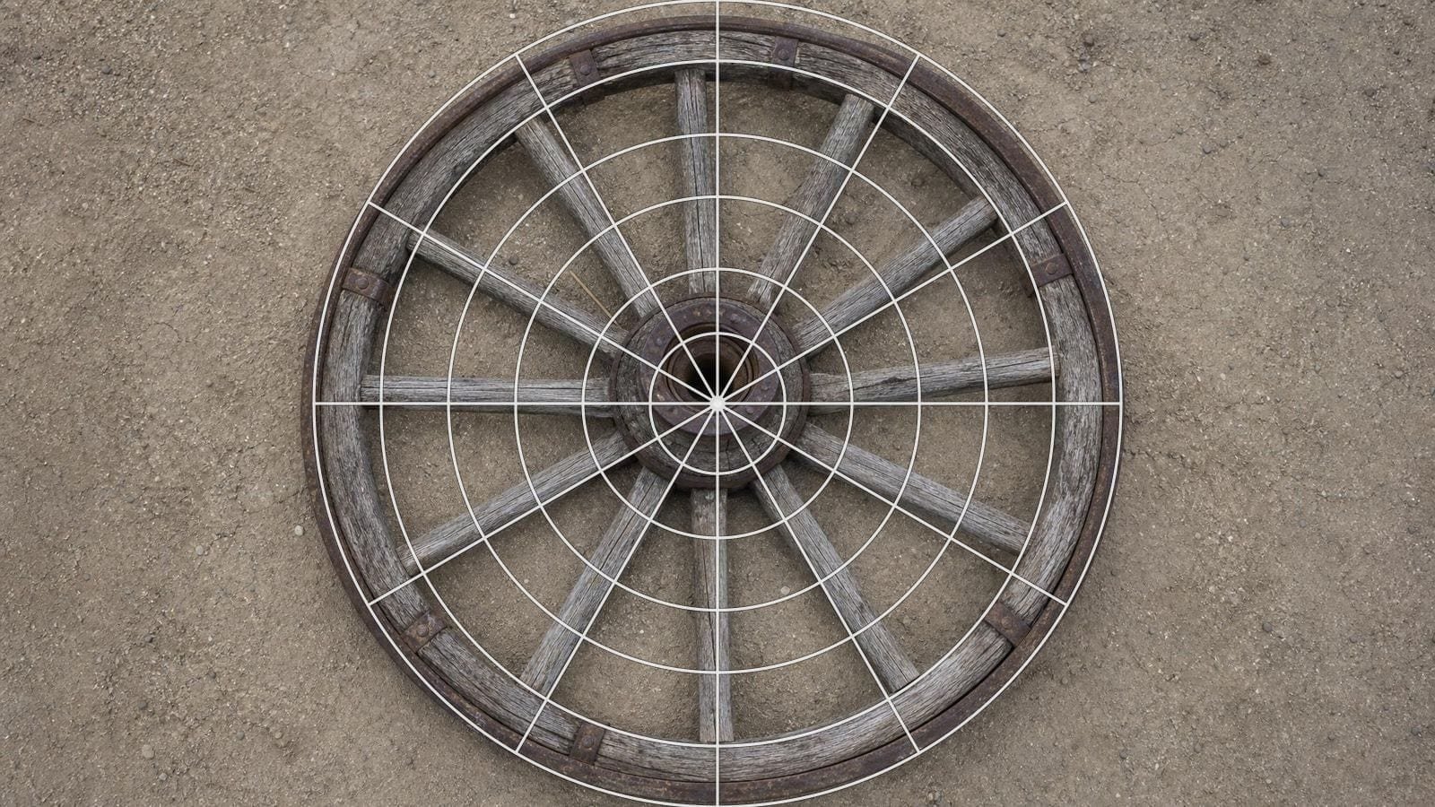 Mandala grid overlay on an old cartwheel with spokes radiating from an iron hub