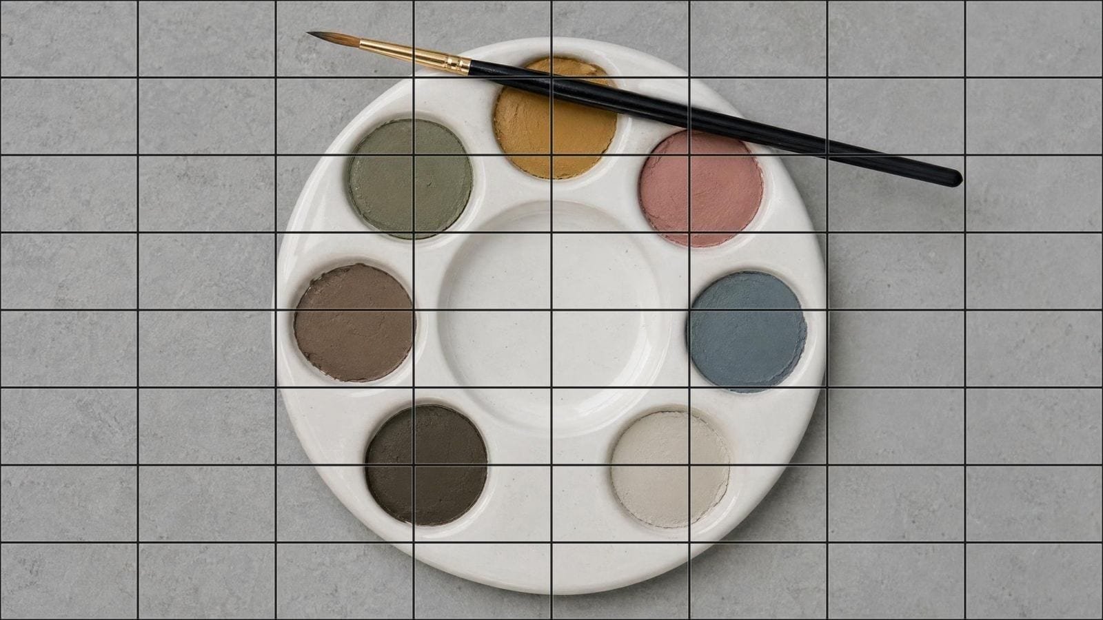 Paint by number overlay on a ceramic palette of mixed earth colours in separate wells
