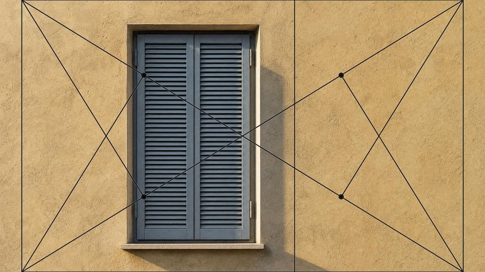 Phi rectangle overlay on a tall shuttered window set in a lime-rendered wall