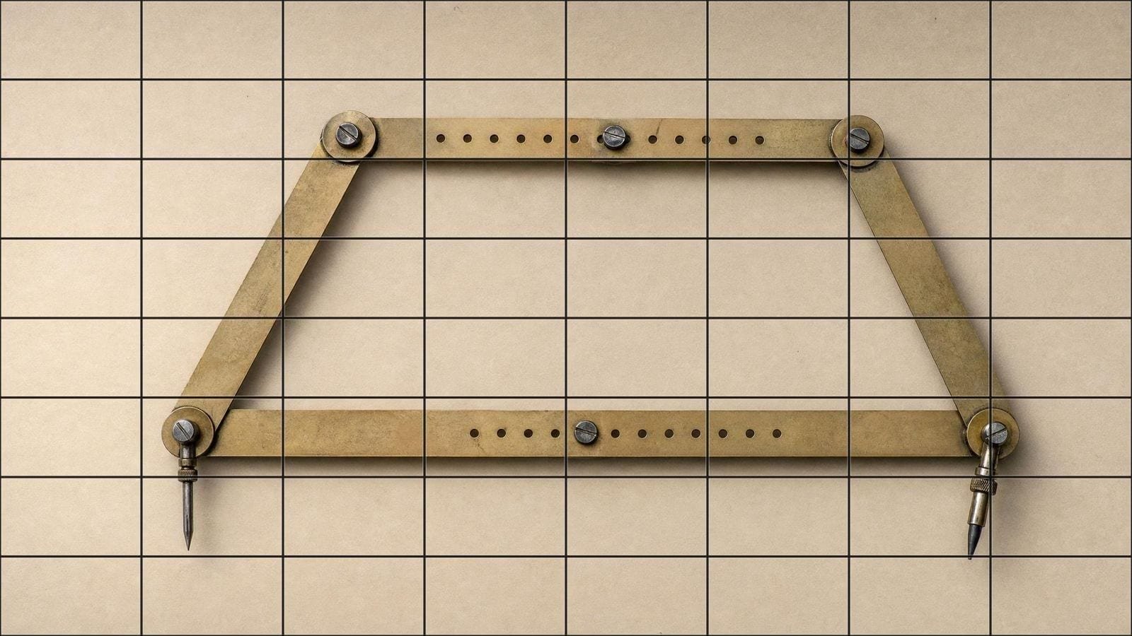 Proportion overlay on a brass pantograph with its arms set for an enlargement