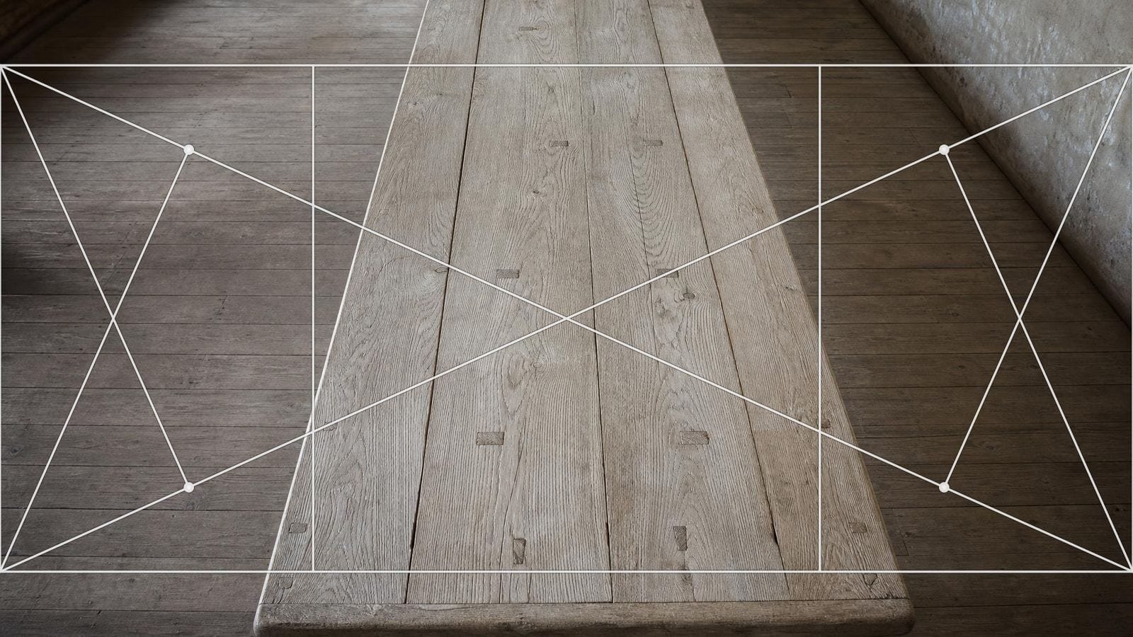 Root 5 armature overlay on a long scrubbed oak refectory table seen down its length