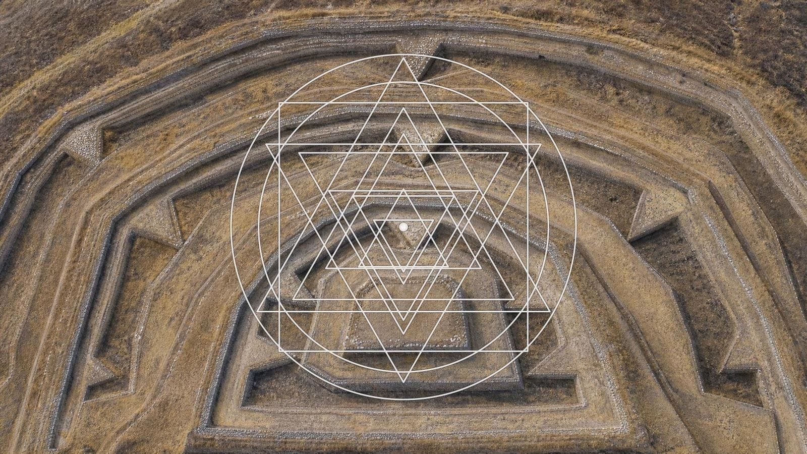 Sri Yantra overlay on a terraced hillside, walls stepping inward to a hilltop platform