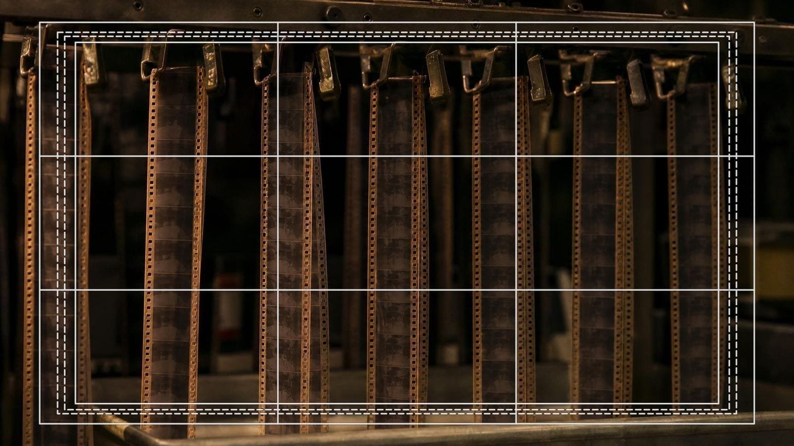 Storyboard frame overlay on trimmed film strips hanging in a cutting room