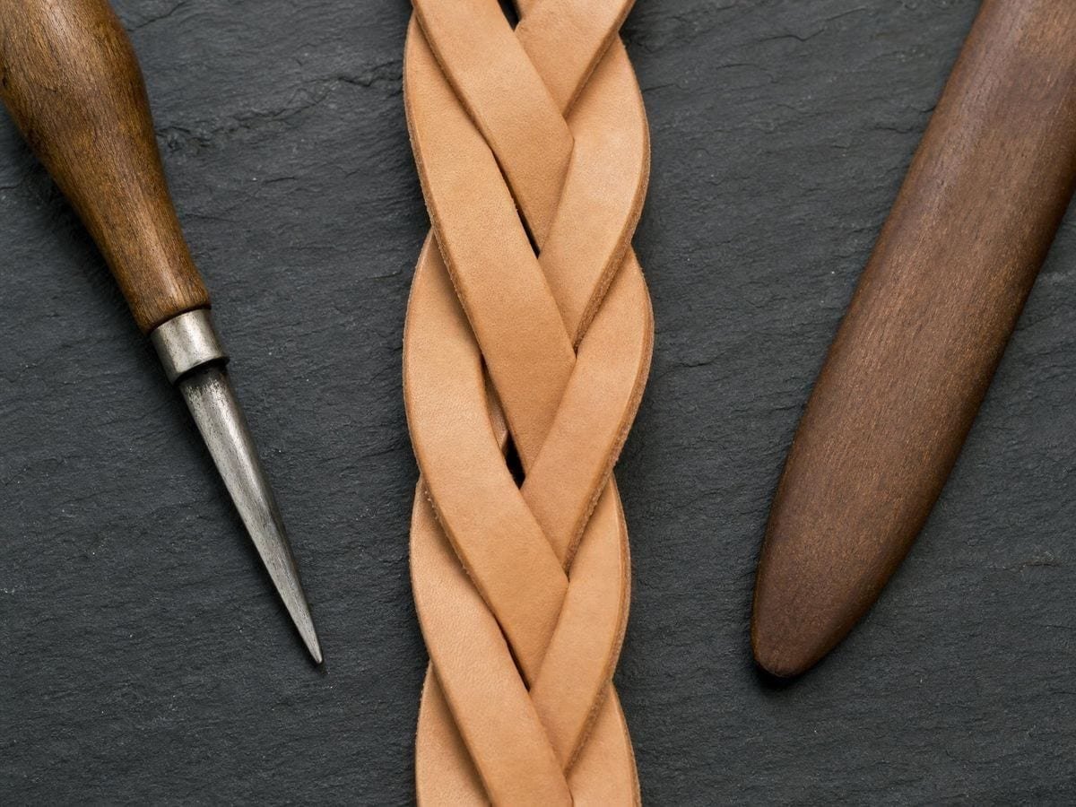 A three-strand plait of undyed leather crossing over and under at an even pitch