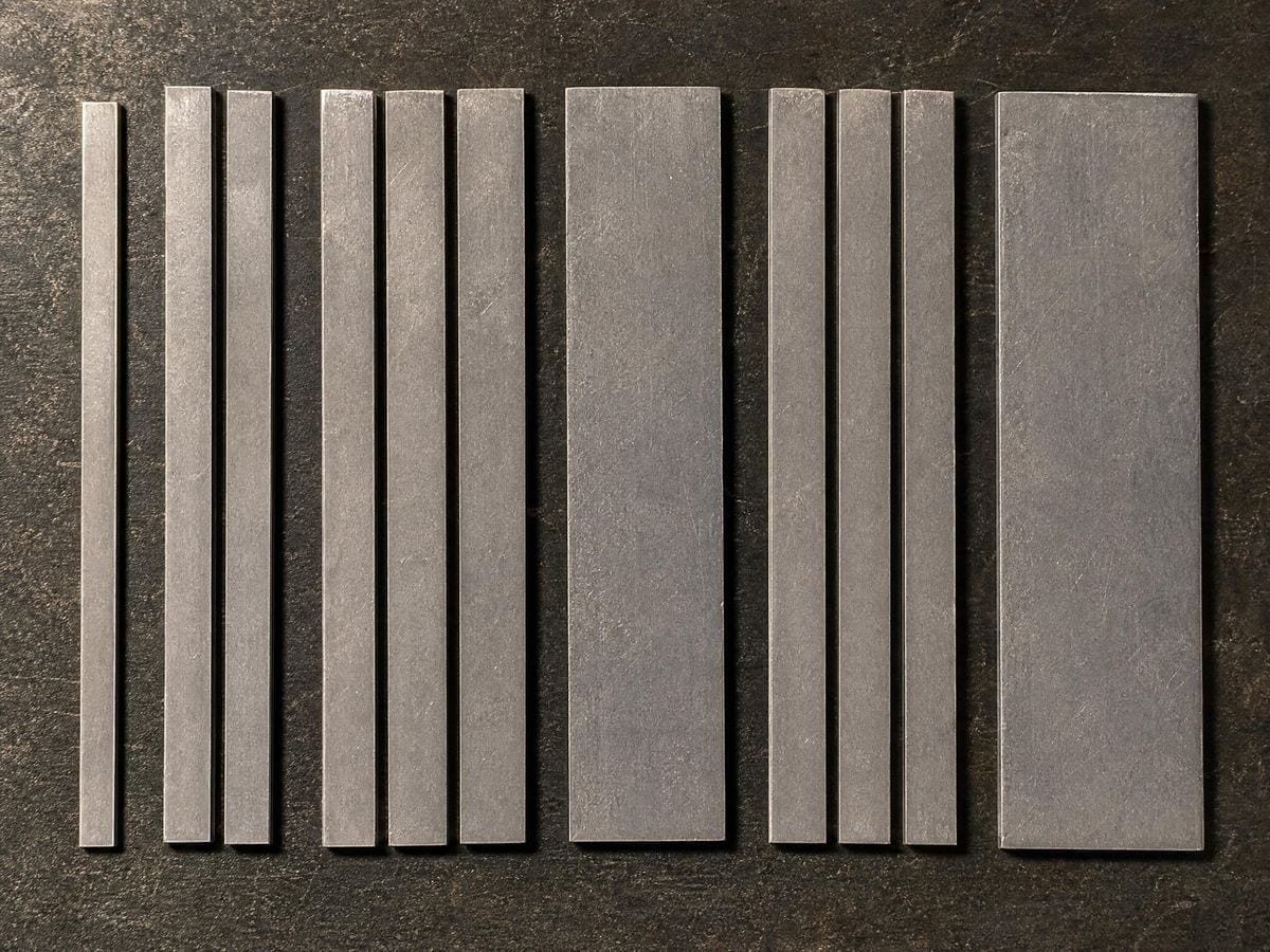 Lead spacing strips of several widths laid parallel, some grouped to match a wider one