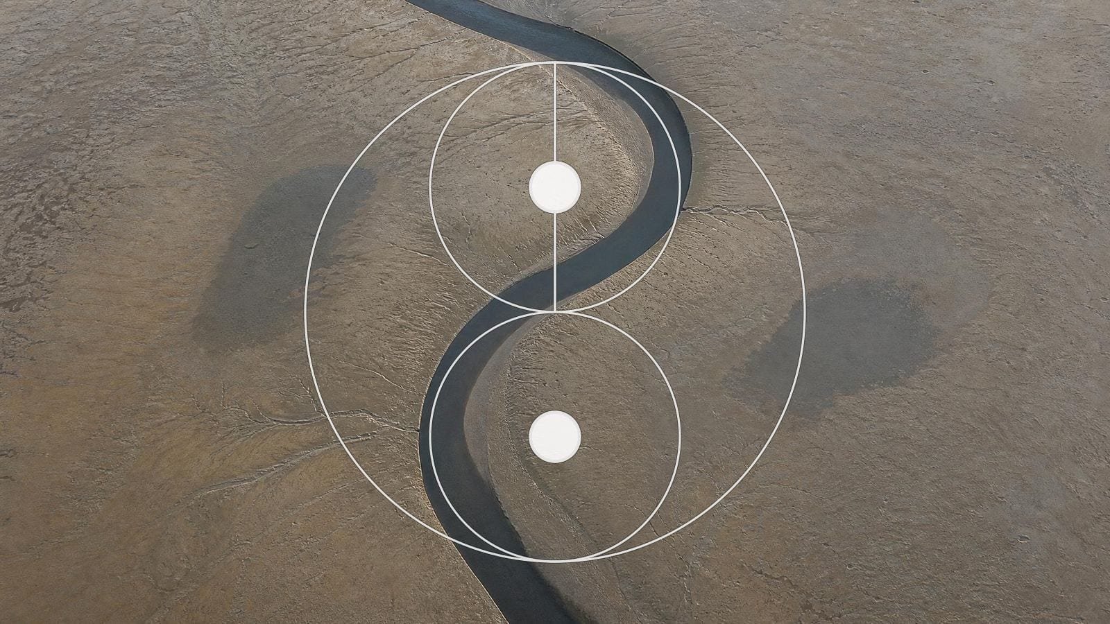 Yin yang overlay on a tidal sandbar divided into two lobes by a curving channel