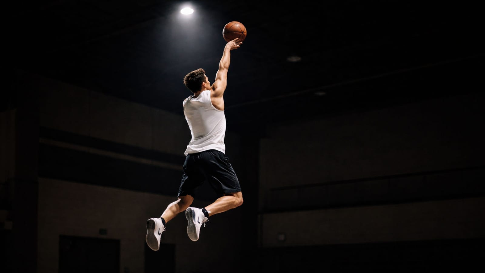 Basketball player at the top of a jump shot, an action reference before the panel grid